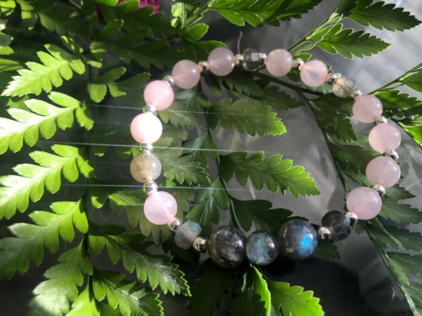 Rose quartz and labradorite bracelet on  leaves